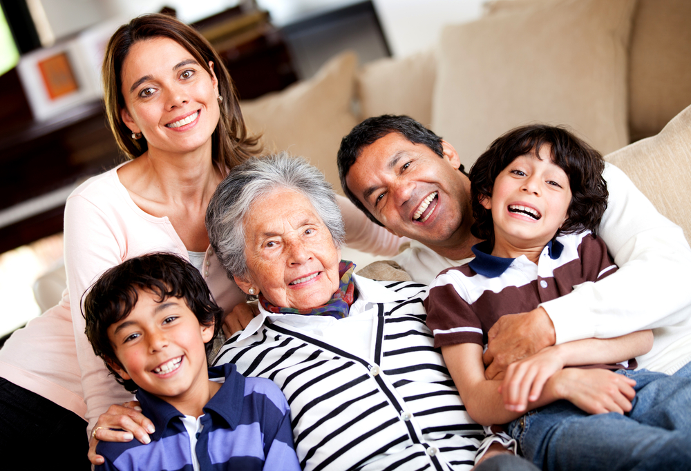 Beautiful three-generation family smiling at home